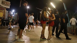 Magaluf residents fury as drunk British holidaymakers wear no masks and jump on cars [upl. by Akenot]